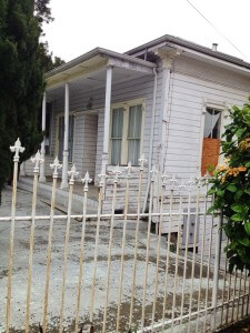 The Kamin family lived in the Lake Merritt District of Oakland. Their house now sits boarded up with locked gates. Photo Credit: Lauren Gonzalves