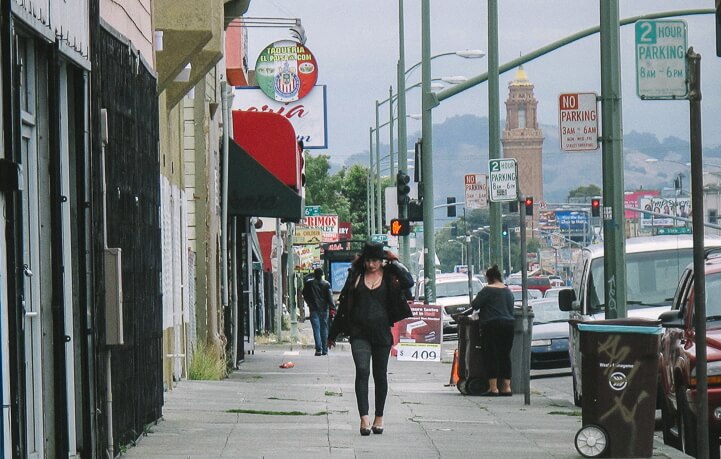 Women working on International Blvd Women walking on International Blvd