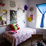 Children's bedroom with pink blankets.