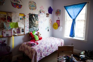Children's bedroom with pink blankets.