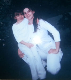 Leah and daughter Angel pose in matching outfits on the first day of kindergarten.