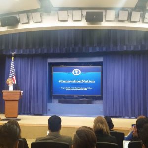 Think Of Us attending a conference.