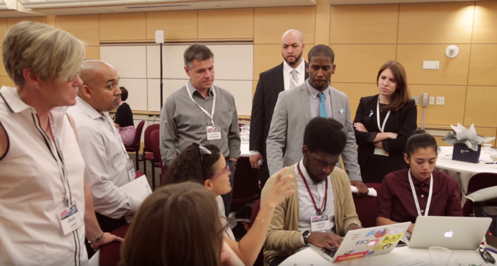 CREDIT: Think of Us, Sixto Cancel, Molly Dillon and hackathon participants mid-hack.