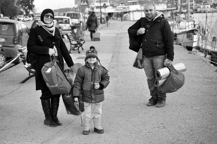 Ammar and his family on their way to the Athens Ferry, Lesbos, Greece. Photo: Emily Scott Pottruck