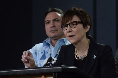 First Nations Child and Family Caring Society Executive Director Cindy Blackstock speaks about the Canadian Human Rights Tribunal regarding discrimination against First Nations children in care. Assembly of First Nations National Chief Perry Bellegarde looks on.