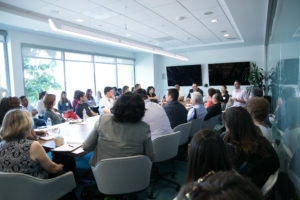 Group gathered around conference table at #HackFosterCareLA