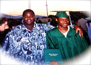 Johnson with foster son Eddie Heights at Heights' high school graduation in 2003. Photo courtesy of Dewayne Johnson
