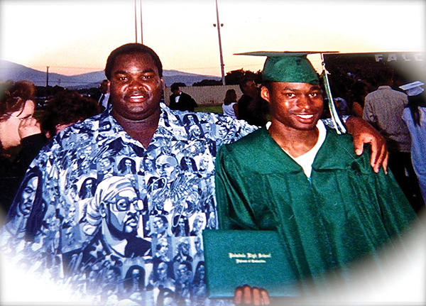 Johnson with foster son Eddie Heights at Heights' high school graduation in 2003. Photo courtesy of Dewayne Johnson