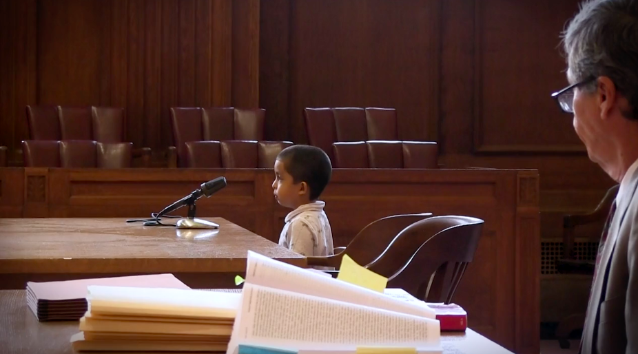 A young boy facing deportation proceedings without legal representation, as shown in the film "Unaccompanied: Alone in America."