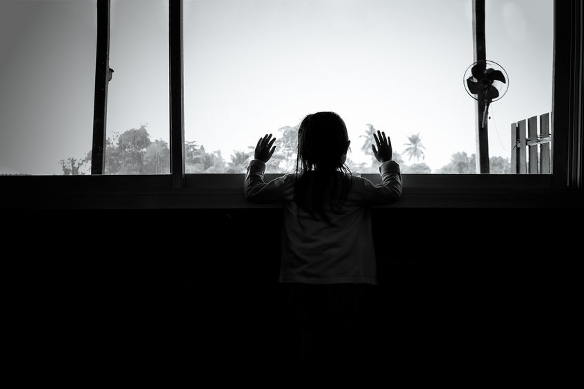 a child looks out a window