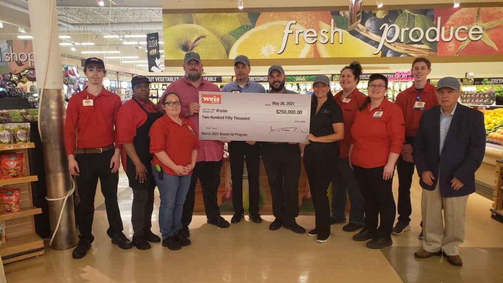 Staff with Weis Markets, a grocery chain that donated $250,000 to iFoster.