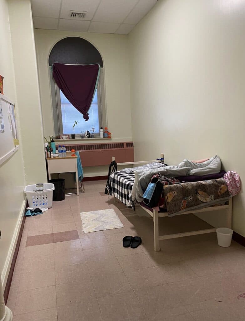 girl's dorm bedroom at St. Anne Institute