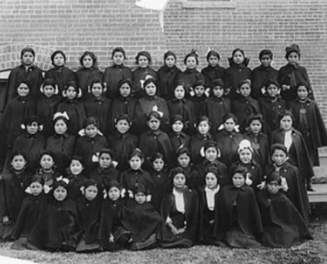 Historic black and white photo of children at the Albuquerque Indian School from the Interior Department's Bureau of Indian Affairs.
